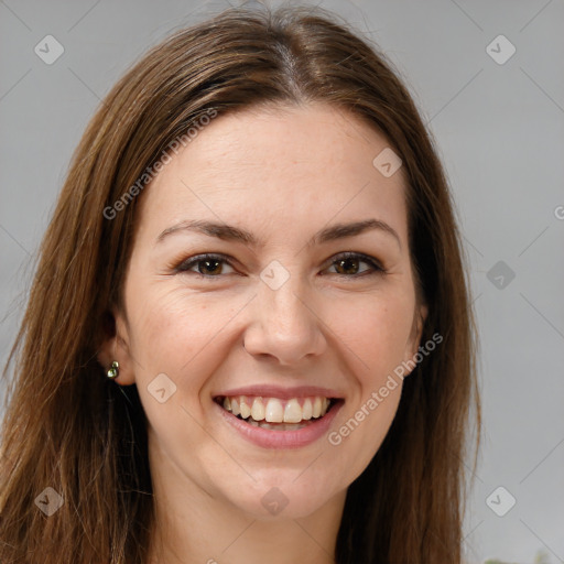 Joyful white young-adult female with long  brown hair and brown eyes