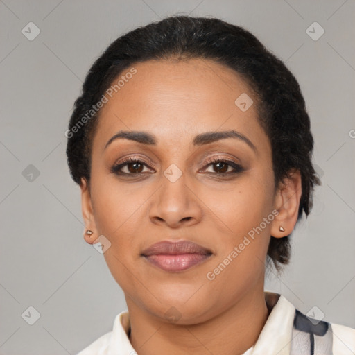 Joyful latino young-adult female with short  black hair and brown eyes