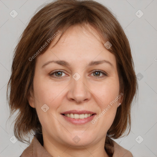 Joyful white adult female with medium  brown hair and brown eyes