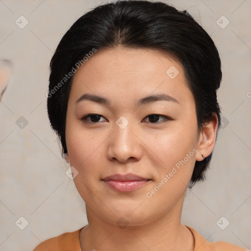 Joyful asian young-adult female with medium  brown hair and brown eyes