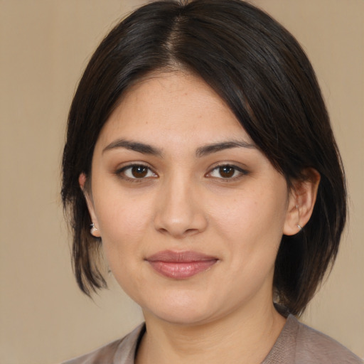 Joyful asian young-adult female with medium  brown hair and brown eyes