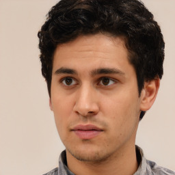 Neutral white young-adult male with short  black hair and brown eyes