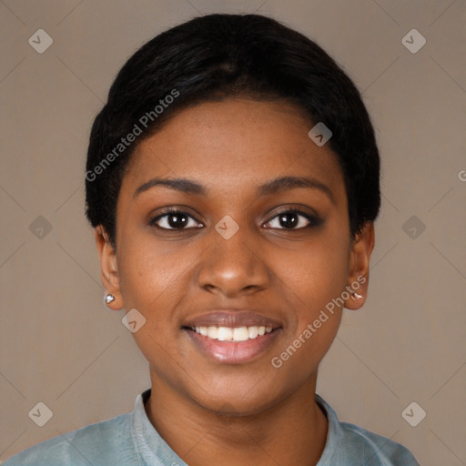 Joyful black young-adult female with short  black hair and brown eyes