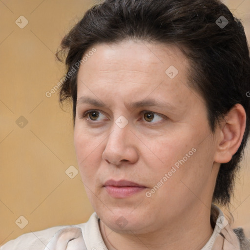 Joyful white adult female with short  brown hair and brown eyes