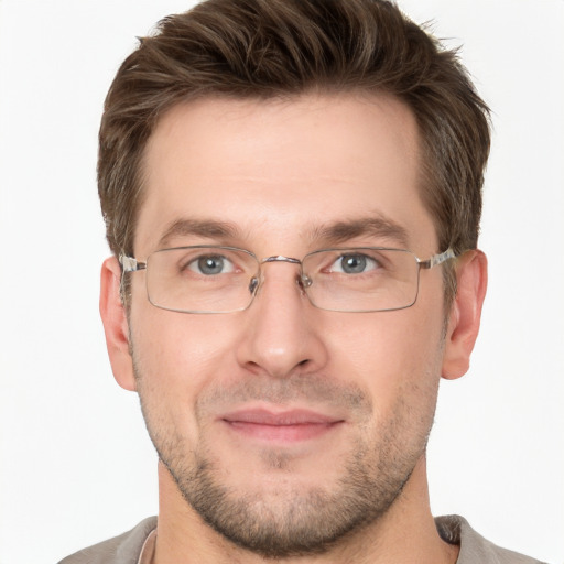 Joyful white adult male with short  brown hair and grey eyes