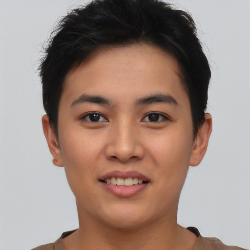 Joyful asian young-adult female with short  brown hair and brown eyes