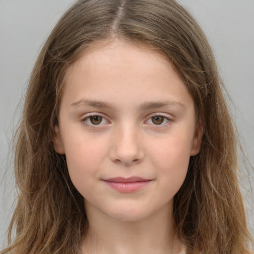 Joyful white child female with long  brown hair and brown eyes