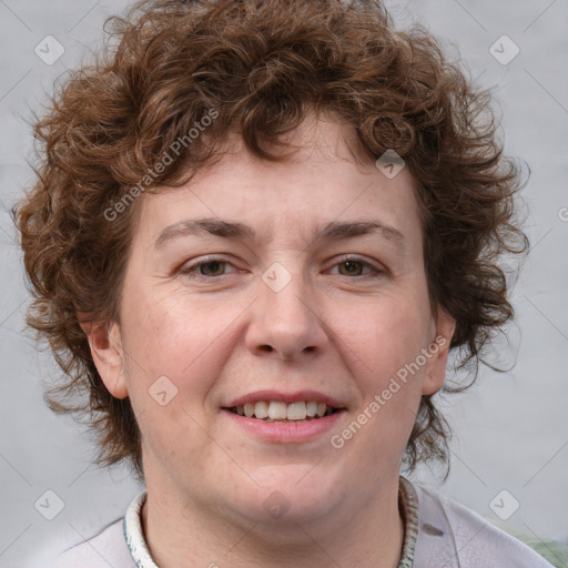 Joyful white adult female with medium  brown hair and blue eyes