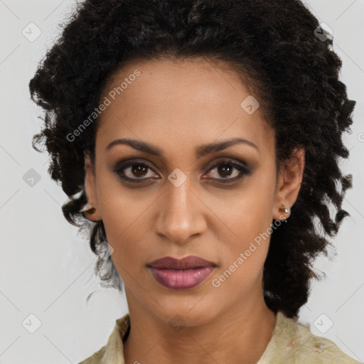 Joyful black young-adult female with medium  brown hair and brown eyes