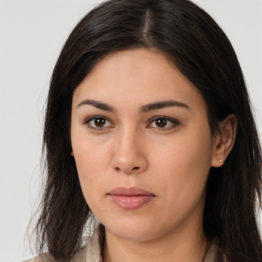 Neutral latino young-adult female with long  brown hair and brown eyes