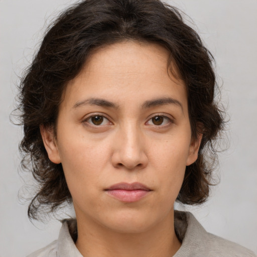Neutral white young-adult female with medium  brown hair and brown eyes