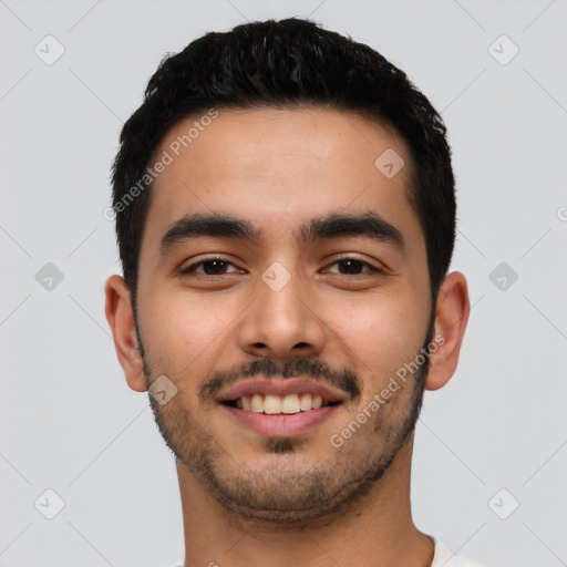 Joyful latino young-adult male with short  black hair and brown eyes