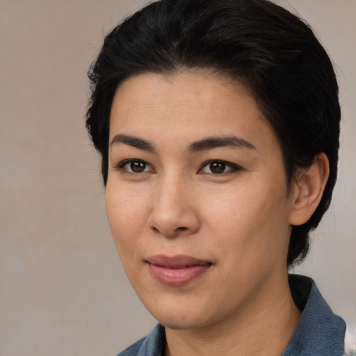 Joyful asian young-adult female with medium  black hair and brown eyes