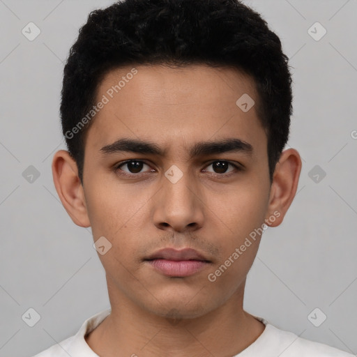 Neutral latino young-adult male with short  black hair and brown eyes