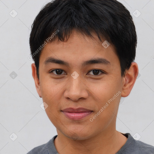 Joyful asian young-adult male with short  brown hair and brown eyes