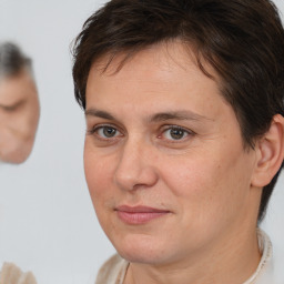 Joyful white adult female with short  brown hair and brown eyes