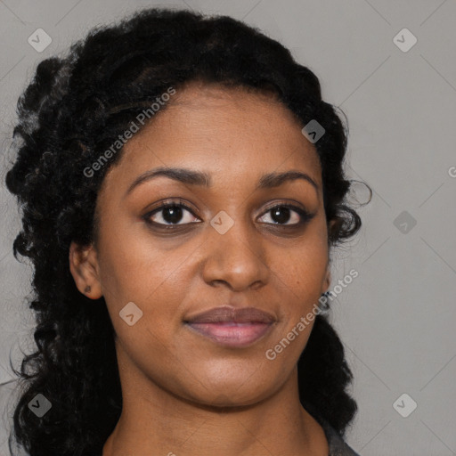 Joyful black young-adult female with long  black hair and brown eyes