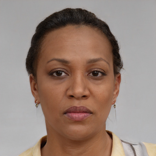 Neutral black adult female with short  brown hair and brown eyes