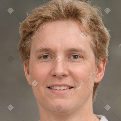 Joyful white adult male with short  brown hair and grey eyes