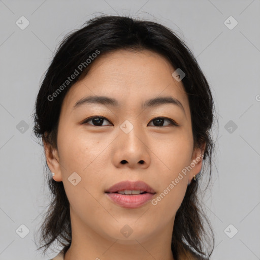 Joyful asian young-adult female with medium  brown hair and brown eyes