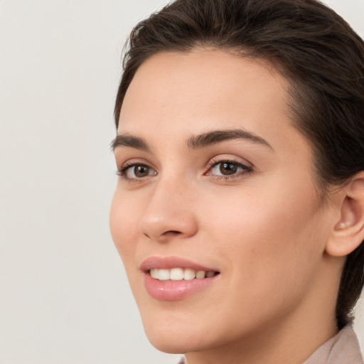 Joyful white young-adult female with medium  brown hair and brown eyes