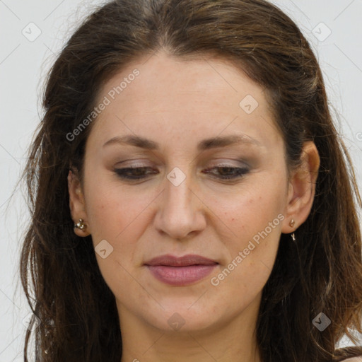 Joyful white adult female with long  brown hair and brown eyes