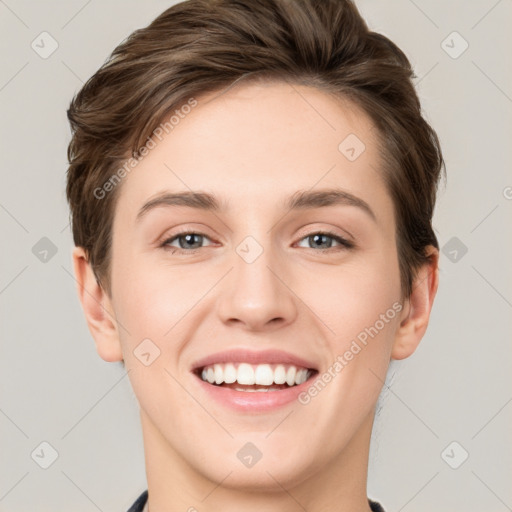 Joyful white young-adult female with short  brown hair and grey eyes