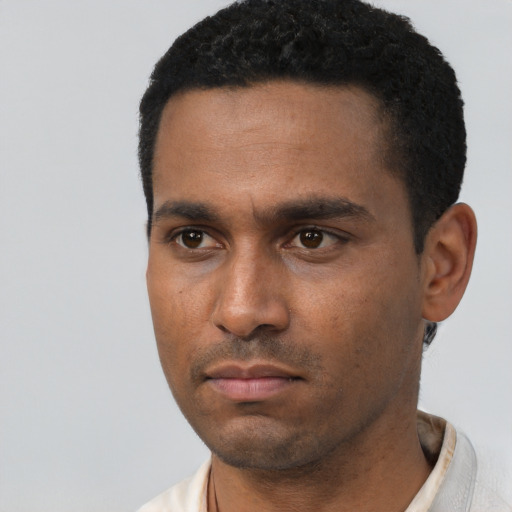 Neutral latino young-adult male with short  black hair and brown eyes