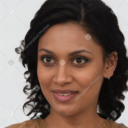 Joyful black young-adult female with long  brown hair and brown eyes