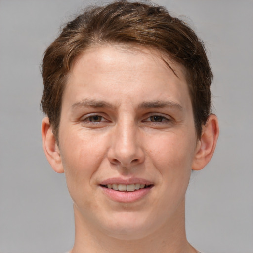 Joyful white adult female with short  brown hair and grey eyes