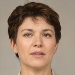 Joyful white adult female with short  brown hair and brown eyes