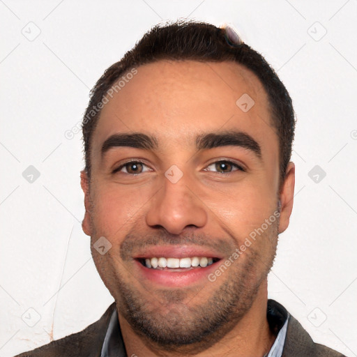 Joyful white young-adult male with short  black hair and brown eyes