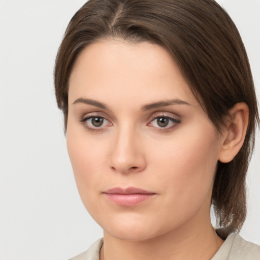 Neutral white young-adult female with medium  brown hair and brown eyes