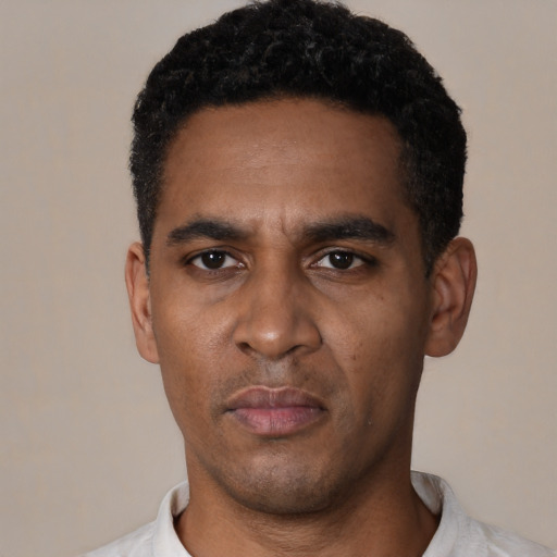 Neutral black young-adult male with short  black hair and brown eyes