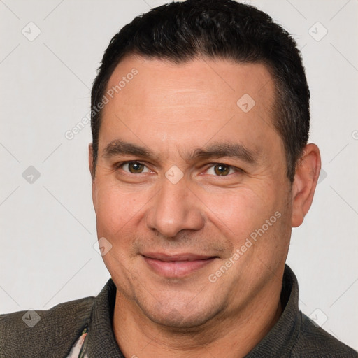 Joyful white adult male with short  brown hair and brown eyes