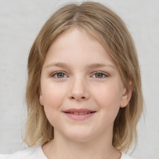 Joyful white child female with medium  brown hair and blue eyes