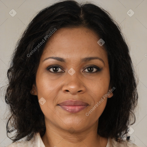 Joyful black adult female with medium  brown hair and brown eyes