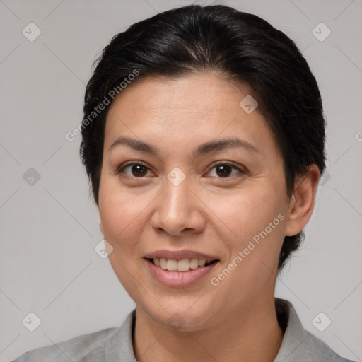 Joyful white adult female with short  brown hair and brown eyes