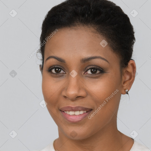 Joyful black young-adult female with short  brown hair and brown eyes