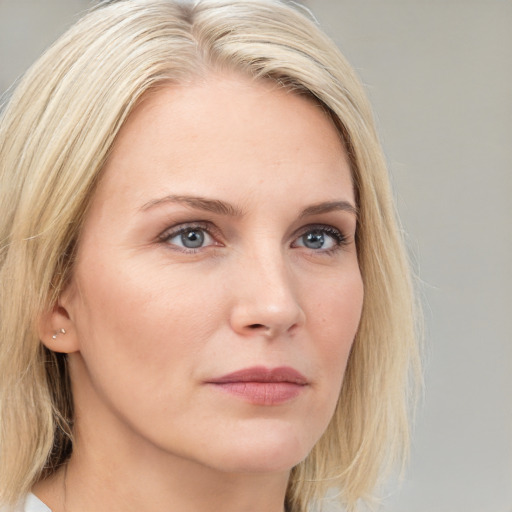 Neutral white young-adult female with long  blond hair and grey eyes