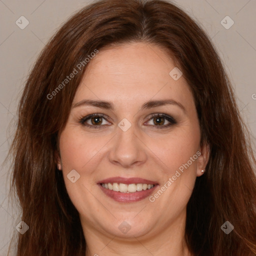 Joyful white adult female with long  brown hair and brown eyes