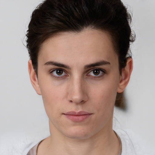 Neutral white young-adult female with short  brown hair and brown eyes