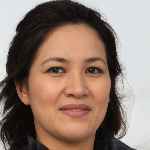 Joyful white adult female with medium  brown hair and brown eyes