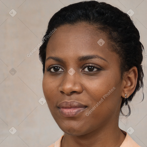 Joyful black young-adult female with medium  black hair and brown eyes