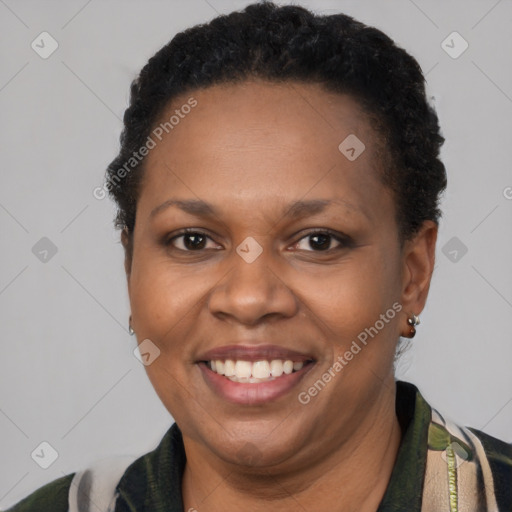 Joyful latino adult female with short  brown hair and brown eyes