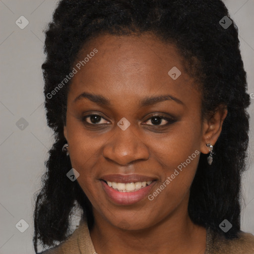 Joyful black young-adult female with long  brown hair and brown eyes