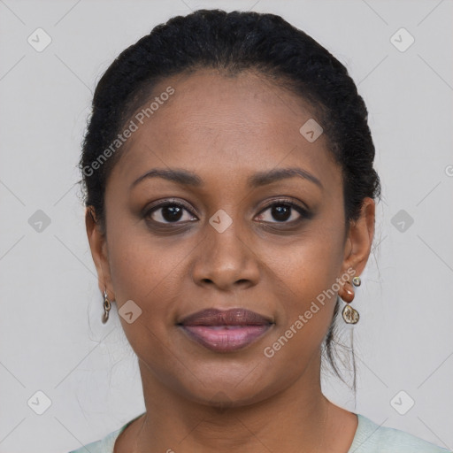 Joyful black young-adult female with short  black hair and brown eyes