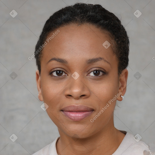 Joyful black young-adult female with short  black hair and brown eyes