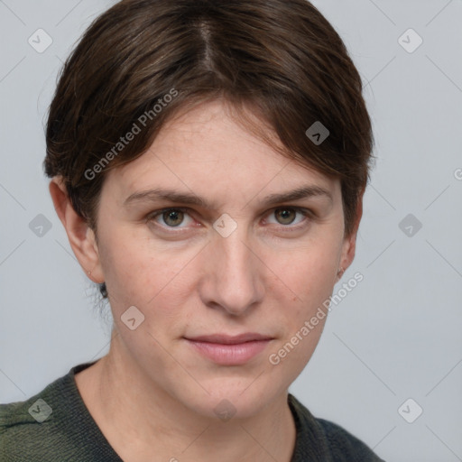 Joyful white young-adult female with short  brown hair and grey eyes