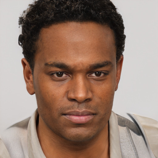 Neutral black young-adult male with short  brown hair and brown eyes